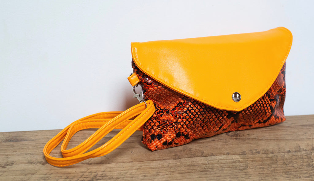 Orange snake sale print clutch bag